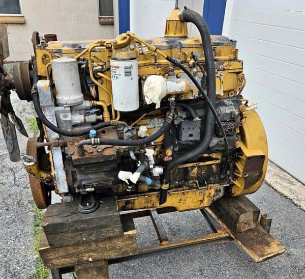 A used Caterpillar 3126 diesel engine sitting on a wooden pallet