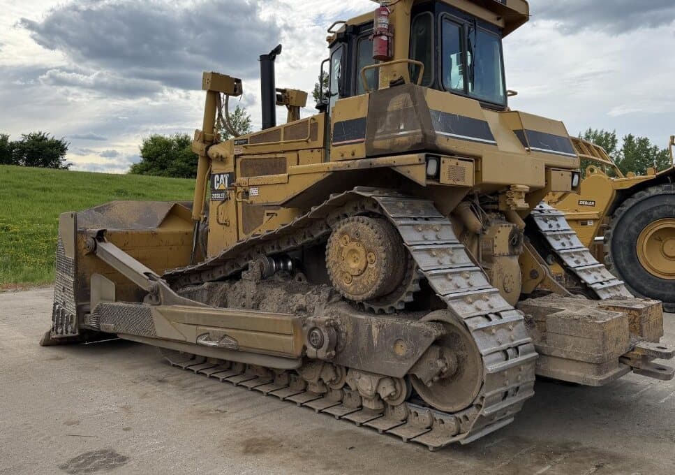 A used Caterpillar D9R track-type tractor with dozer blade